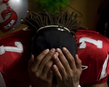 Less than 30 minutes before taking on Florida Atlantic University, senior Quinterrance Cooper listens to his iPod in the locker room inside Houchens Industries L.T. Smith Stadium Nov. 6. Cooper, a wide receiver from St. Augustine, Fla., is one of seven seniors who have been playing for the Hilltoppers since the team first moved to the Division 1 Bowl Subdivision on a provisional status in 2007 and had been through 10 wins, 34 losses and two head coaches going into the game against FAU. WKU lost to FAU 16-17.
