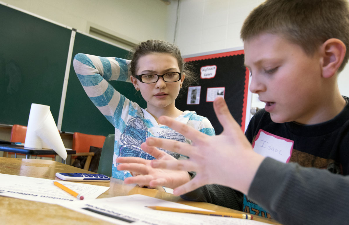 Olivia Taylor (left) and Isaac Bunch work out a problem together in Mathematical Patterns in Nature during Winter Super Saturdays Feb. 7, 2015.