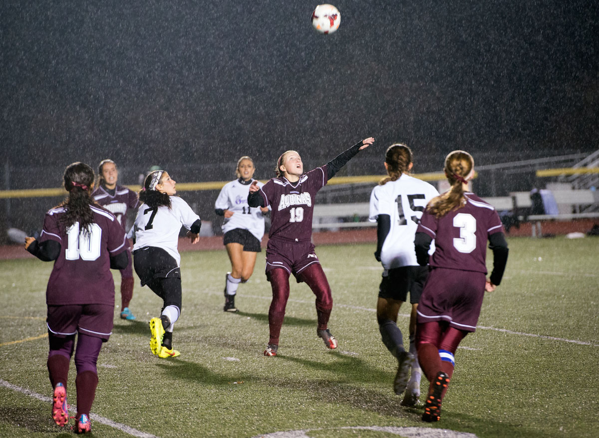 Aquinas sophomore Lauren Begy (19) prepares to head the ball during the second half of the Section V Class B championship Oct. 31 at Caledonia-Mumford Central School in Caledonia. After four overtime periods, Aquinas won a penalty-kick shootout to advance to State.