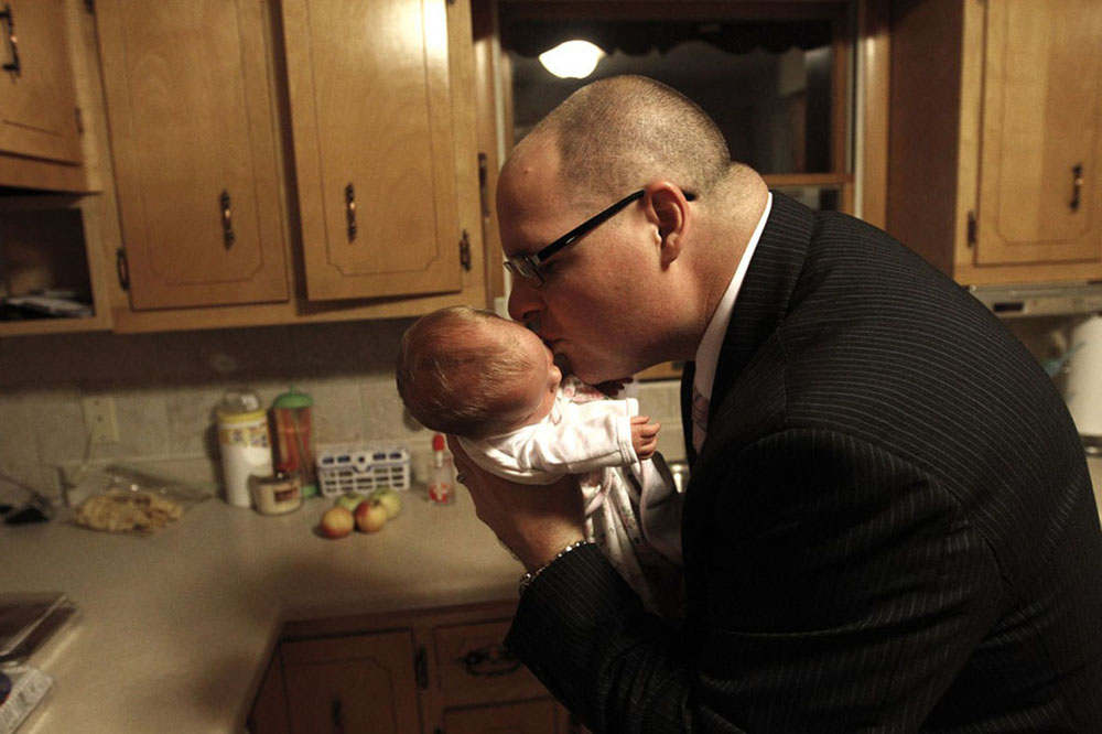 Anslee Tipton, 13 days old, captures her father's attention.